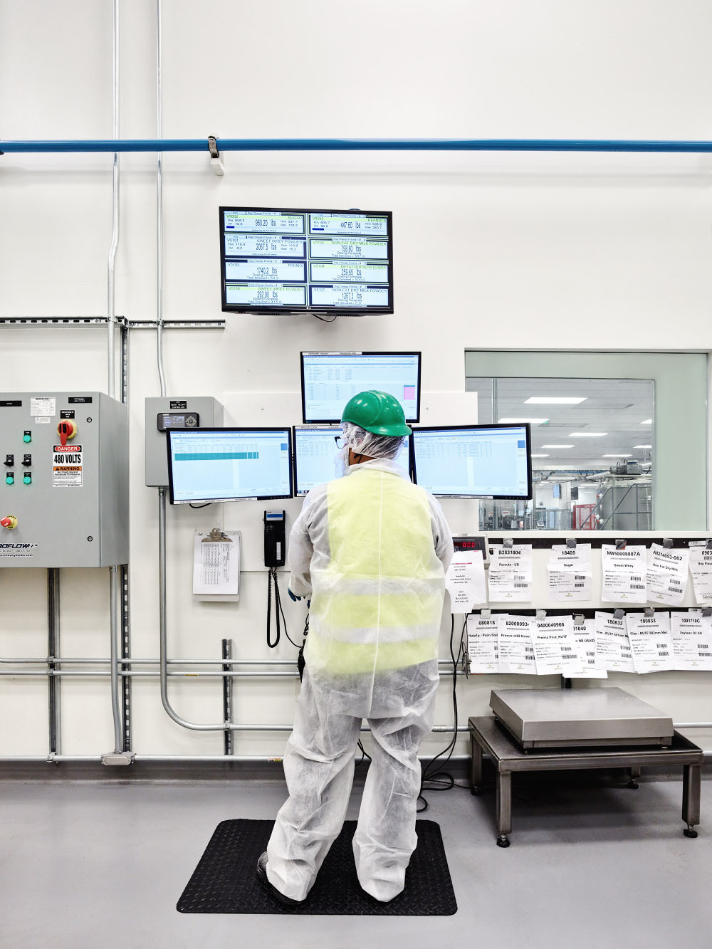 Factory worker checking water activity in the Software