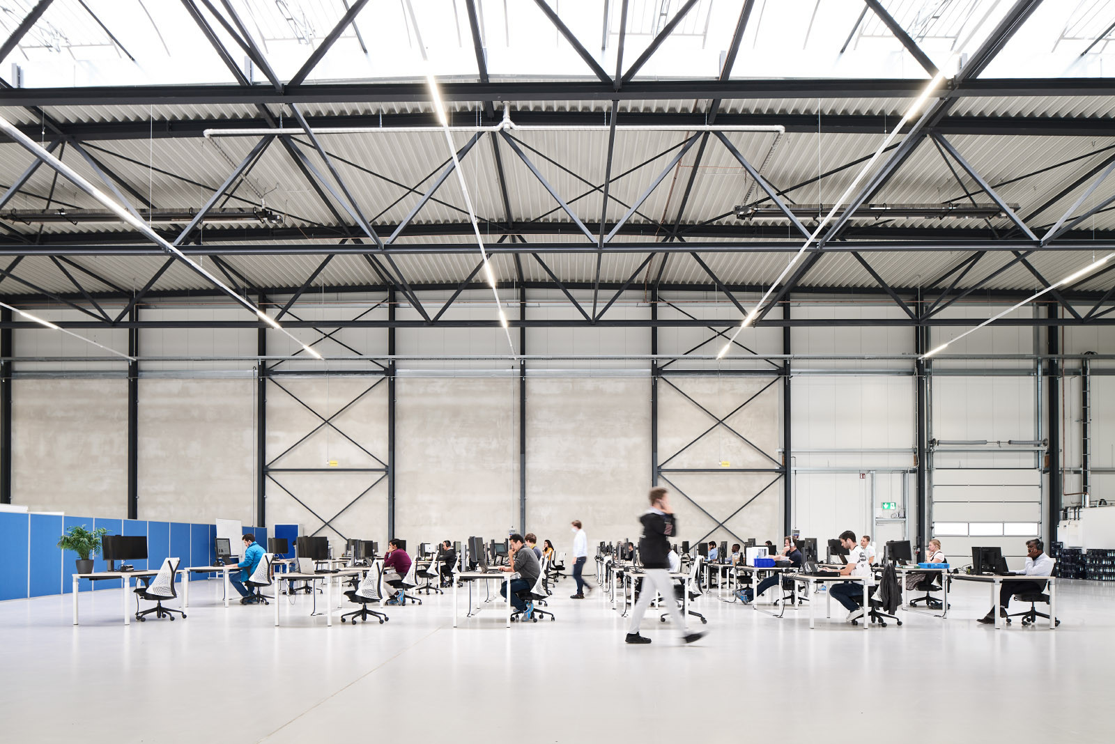 People (engineers) working inside a Lilium Hangar